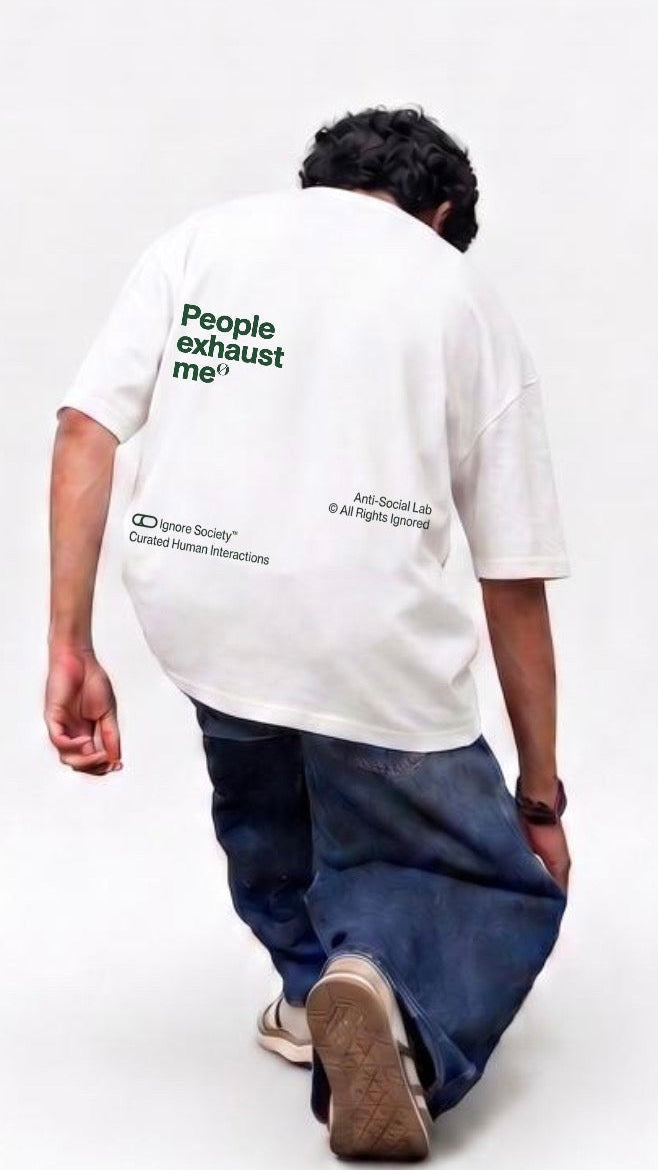 Person wearing a white t-shirt with text on the back, standing against a white background